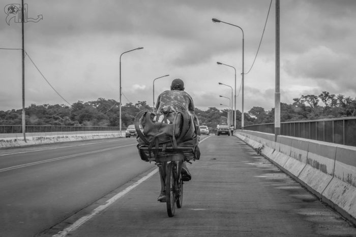 Homeless guy biking back to Brazil.